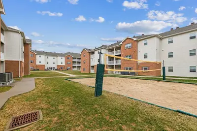a volleyball court in the middle of an apartment complex at Bright and Connected Your Ideal Getaway in Mansfield