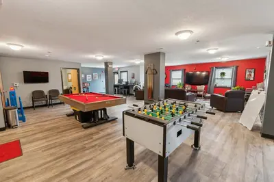 a living room with a pool table and a billiard at Bright and Connected Your Ideal Getaway in Mansfield