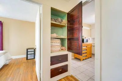 a room with a closet with wooden drawers at Home 2 Mi to Lakewood Park and Solstice Steps! in Lakewood