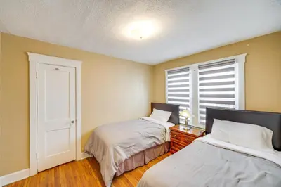 a bedroom with two beds and a window at Home 2 Mi to Lakewood Park and Solstice Steps! in Lakewood