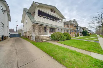 a house on a street with a sidewalk at Home 2 Mi to Lakewood Park and Solstice Steps! in Lakewood