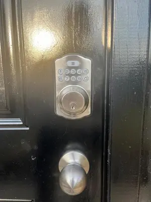 a metal door with a control panel on it at Liberty Twp Spacious 4 bedroom house in Middletown