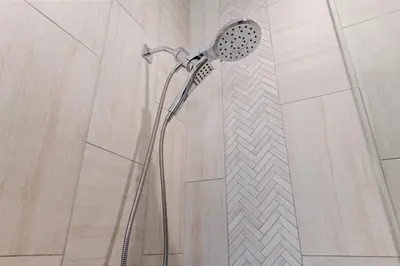 a shower in a bathroom with a shower head at Downtown Free Parking Garage - 5 min walk OTR in Cincinnati