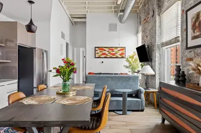 a kitchen and living room with a table and chairs at Downtown Free Parking Garage - 5 min walk OTR in Cincinnati