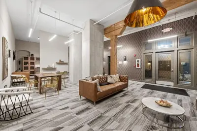a living room with a couch and a table at Downtown Free Parking Garage - 5 min walk OTR in Cincinnati