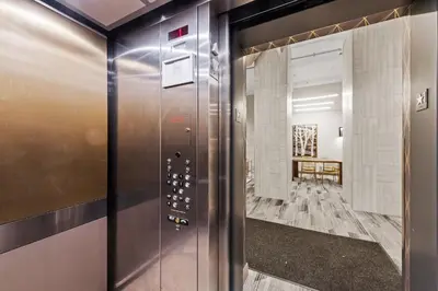 an elevator in a room with a hallway at Downtown Free Parking Garage - 5 min walk OTR in Cincinnati