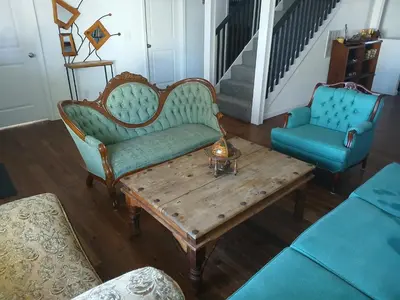 a living room with two chairs and a coffee table at Branson House Bed & Breakfast in Marion