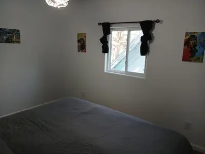 a bedroom with a bed and a window at Branson House Bed & Breakfast in Marion