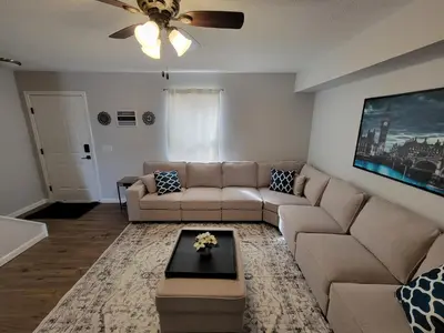 a living room with a couch and a table at The Third Monkey in Williamstown