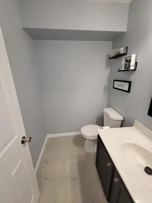 a bathroom with a toilet and a sink at The Third Monkey in Williamstown
