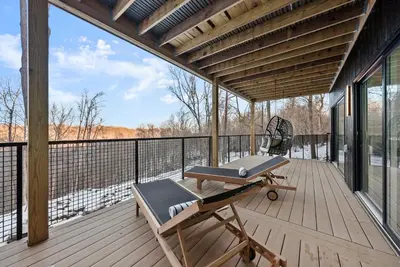 a deck with a bench and a chair on it at Adamina Canyon Luxurious, Canyon View 5BR,3BTH in Rockbridge