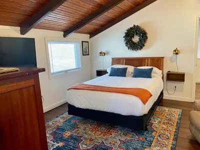 a bedroom with a large bed and a television at Trillium Ridge, Hocking Hills Area, 2 Bedroom, 3 Beds in Rockbridge