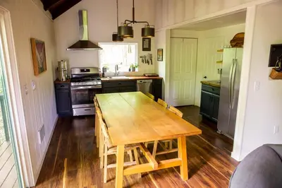 a kitchen with a wooden table in the middle of it at Trillium Ridge, Hocking Hills Area, 2 Bedroom, 3 Beds in Rockbridge