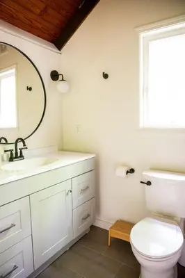 a bathroom with a toilet and a sink and a window at Trillium Ridge, Hocking Hills Area, 2 Bedroom, 3 Beds in Rockbridge