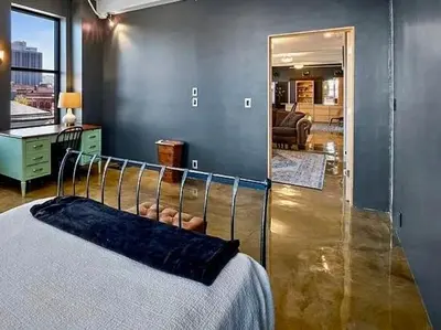 a bedroom with a bed and a large mirror at Lee Flat in Charleston