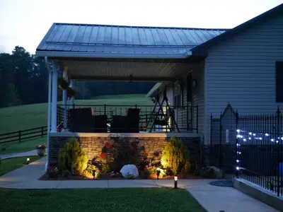 a pergola on the side of a house at PineRidge Country Retreat with In ground Pool and Hot Tub in Langsville
