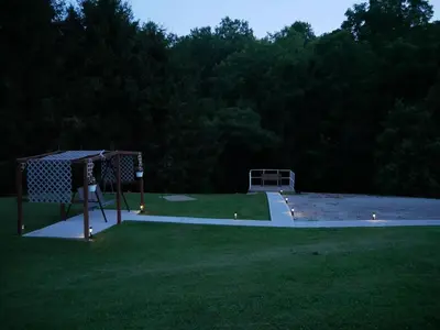 a park with a basketball hoop in the grass at PineRidge Country Retreat with In ground Pool and Hot Tub in Langsville