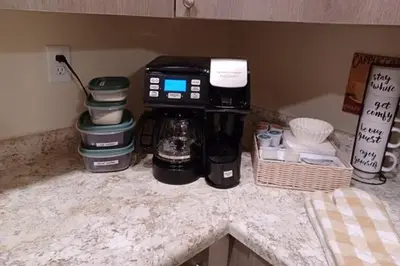 a coffee maker sitting on top of a counter at Coastal Retreat in Sandusky