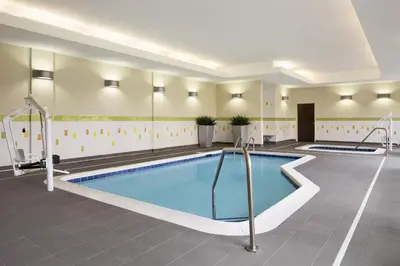 a swimming pool in a hospital room with a pool at Fairfield Inn & Suites by Marriott Akron Fairlawn in Montrose