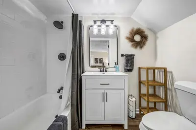 a bathroom with a sink and a tub and a toilet at New Renovated 1BR with King Modern Comfort in Berea