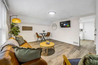 a living room with a couch and a table at New Renovated 1BR with King Modern Comfort in Berea