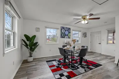 a dining room with a table and chairs at Cosy house, home away from home in Grove City