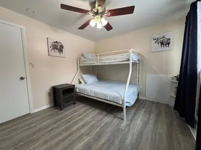 a bedroom with a bunk bed and a ceiling fan at Apt Near Oberlin College in Oberlin
