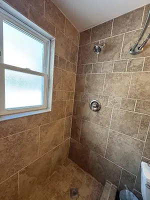 a bathroom with a shower with a window at Apt Near Oberlin College in Oberlin