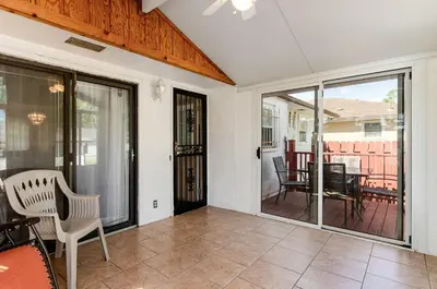 a living room with sliding glass doors and a patio at Gates getaway in Columbus