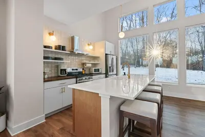 a kitchen with white cabinets and a large window at Adamina Canyon Luxurious, Canyon View 5BR, 3BTH 1 in Rockbridge