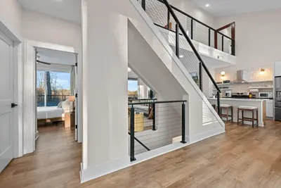 a staircase in a house with a living room at Adamina Canyon Luxurious 5BR 3BTH 2 in Rockbridge