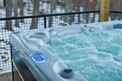 a hot tub with water pouring into it at Adamina Canyon Luxurious 5BR 3BTH 2 in Rockbridge