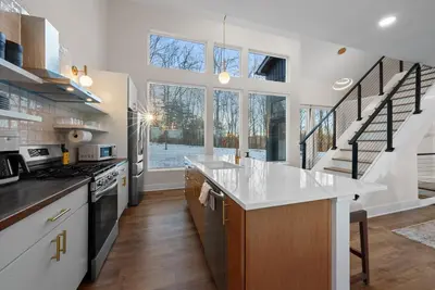 a kitchen with white countertops and a staircase at Adamina Canyon Luxurious, Canyon View 5BR 3BTH 3 in Rockbridge