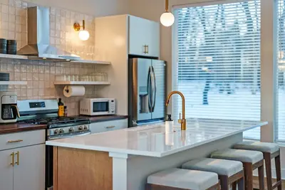a kitchen with a white counter top and a sink at Adamina Canyon Luxurious Villa with Wellness room 5 in Rockbridge