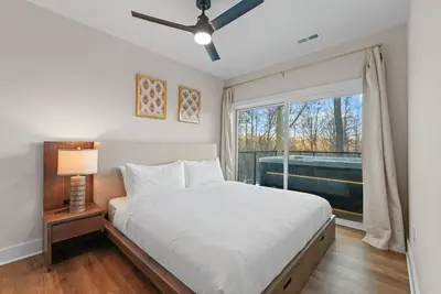 a bedroom with a bed and a large window at Adamina Canyon Luxurious Villa with Wellness room 5 in Rockbridge