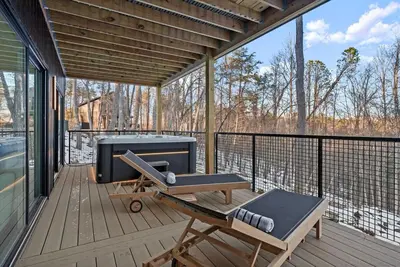 a screened in porch with a grill and a bench at Adamina Canyon Luxurious Villa with Wellness room 5 in Rockbridge
