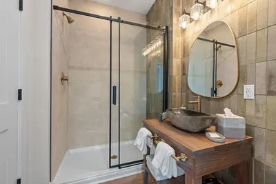 a bathroom with a tub and a sink and a mirror at Adamina Canyon Luxurious, Canyon View 5BR 3BTH- 6 in Rockbridge