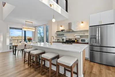 a kitchen with a large white island with bar stools at Adamina Canyon Luxurious, Brand New 5BR 3BTH 7 in Rockbridge