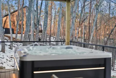 a hot tub on a balcony with a view of trees at Adamina Canyon Luxurious, Canyon View 5BR 3BTH 8 in Rockbridge