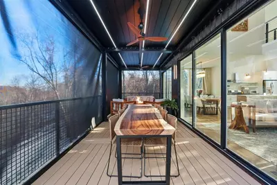 a large deck with a wooden table on a balcony at Adamina Canyon Luxurious, Canyon View 5BR 3BTH 8 in Rockbridge