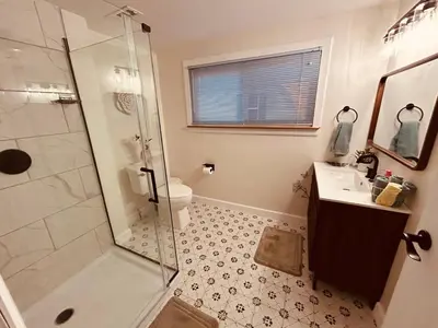 a bathroom with a shower and a sink and a toilet at Paisley Garden House Near Kings Daughters Hospital in Ashland