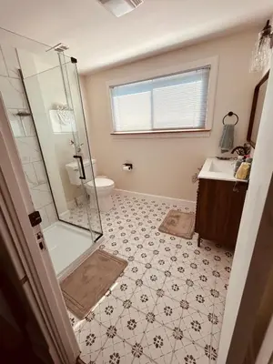 a bathroom with a shower and a toilet and a sink at Paisley Garden House Near Kings Daughters Hospital in Ashland