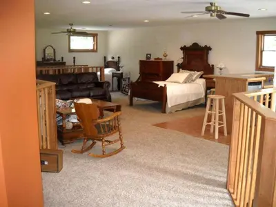 a large living room with a bed and a couch at Peaceful Getaway on a Lovely Farm near Hillsboro, Ohio