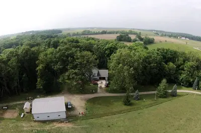 an aerial view of a farm with a house and trees at Romantic Room Rental on a Lovely Farm near Hillsboro, Ohio