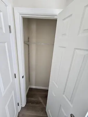 a hallway with a door open to a closet at Cozy New Const. Ranch Near Park in Middletown
