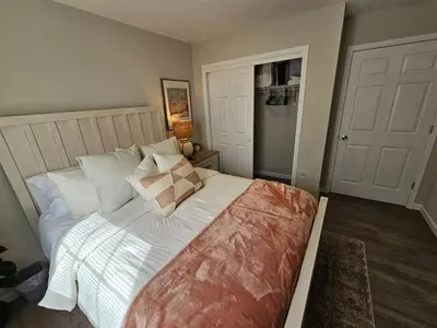 a bedroom with a bed with white sheets and pillows at Beautiful NEW Wilmington Ranch in Wilmington