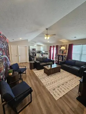a large living room with couches and a living room with a table at Vroooom . . . . the ROAD is calling. . . . in Trenton