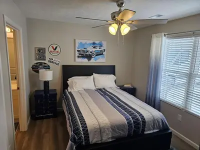 a bedroom with a bed and a ceiling fan at Vroooom . . . . the ROAD is calling. . . . in Trenton