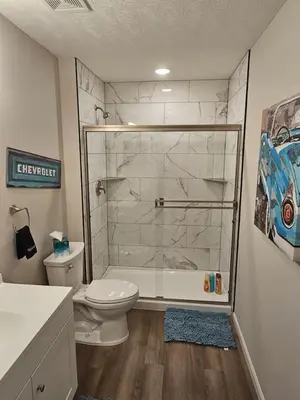 a bathroom with a shower with a toilet and a sink at Vroooom . . . . the ROAD is calling. . . . in Trenton
