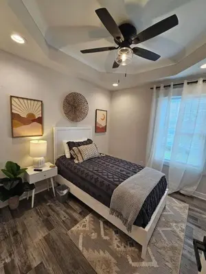a bedroom with a bed and a ceiling fan at Upscale New Construction Ranch in Middletown